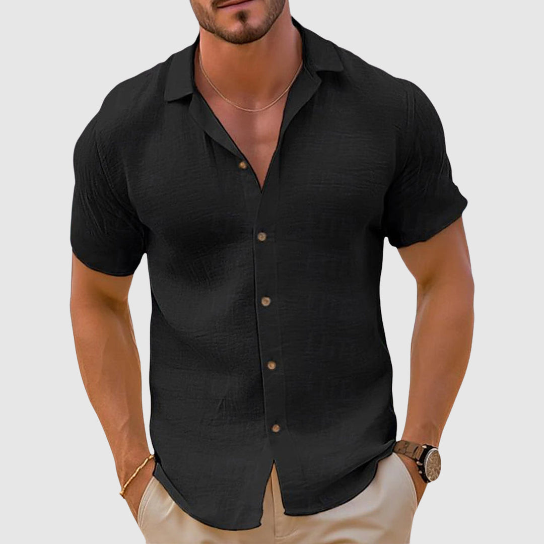 Casual long-sleeve men's linen shirt. Relaxed button-down style ideal for versatile summer and beach outfits.
