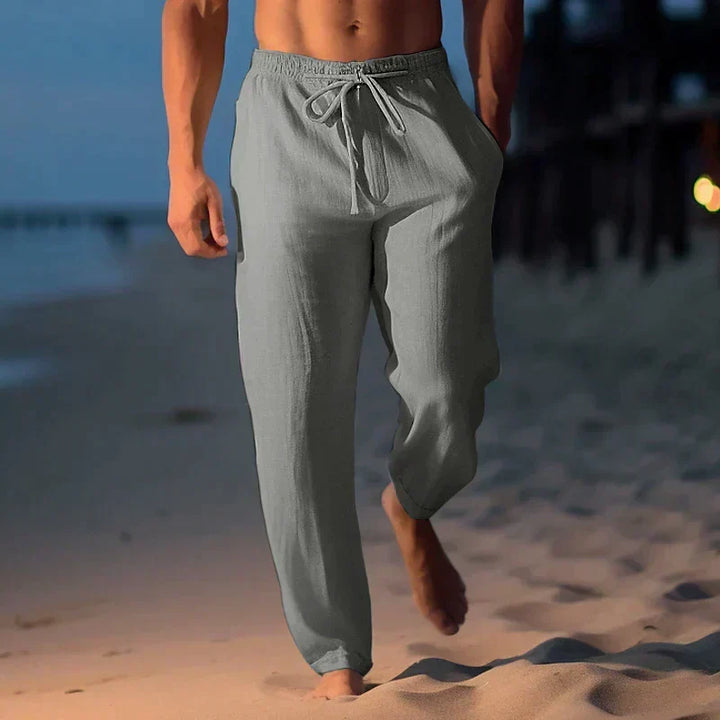 Men's relaxed fit linen pants with drawstring waist, perfect for summer casual wear & beach vacations.