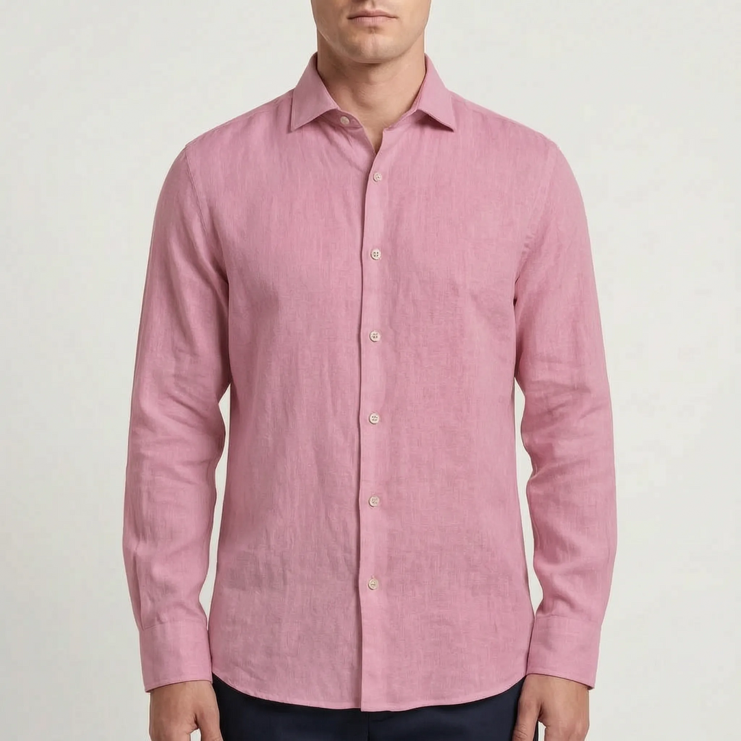 Man wearing a relaxed fit long-sleeve button-up shirt, perfect for a casual summer day or travel.