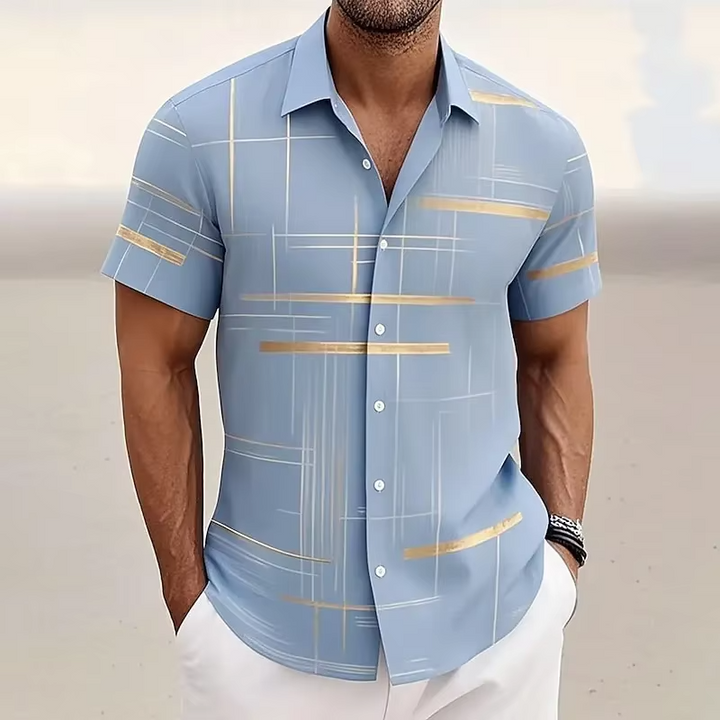 Modern men's polo shirt with a bold geometric print and relaxed fit. Essential for stylish casual fashion.