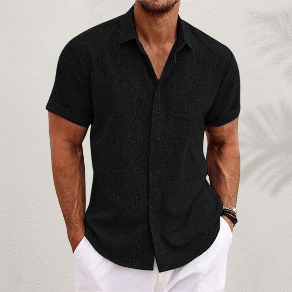 Comfortable men's relaxed fit short sleeve button shirt for effortless style & warm weather, ideal for casual outfits.