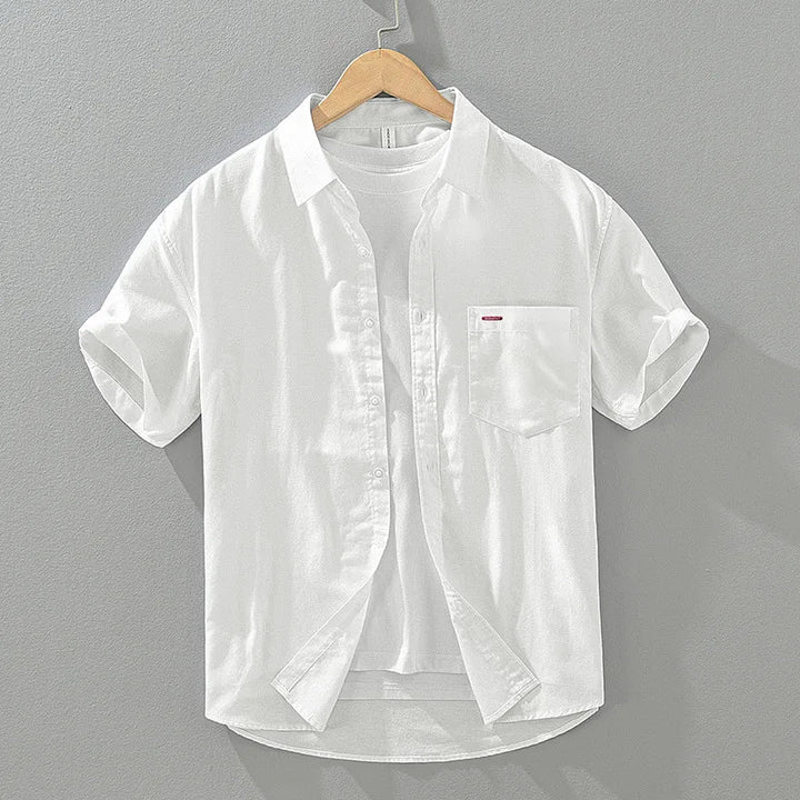 Close-up: Men's button-up summer shirt with chest pocket. Smart casual, relaxed fit, perfect for warm weather.