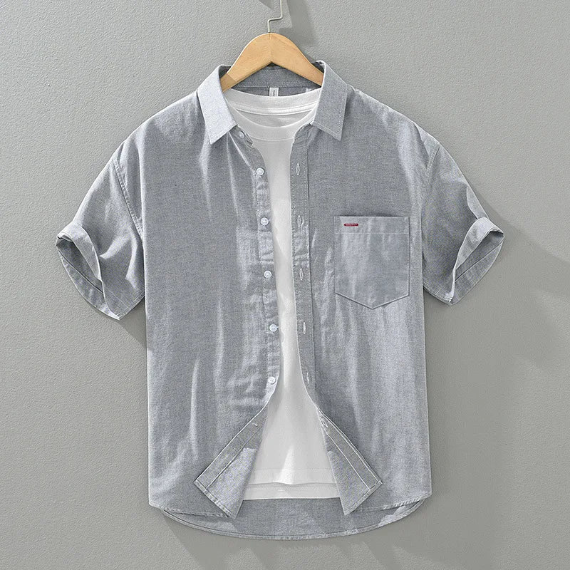Versatile men's summer shirt with a relaxed fit, short sleeve button-up. Perfect for smart casual warm weather looks.