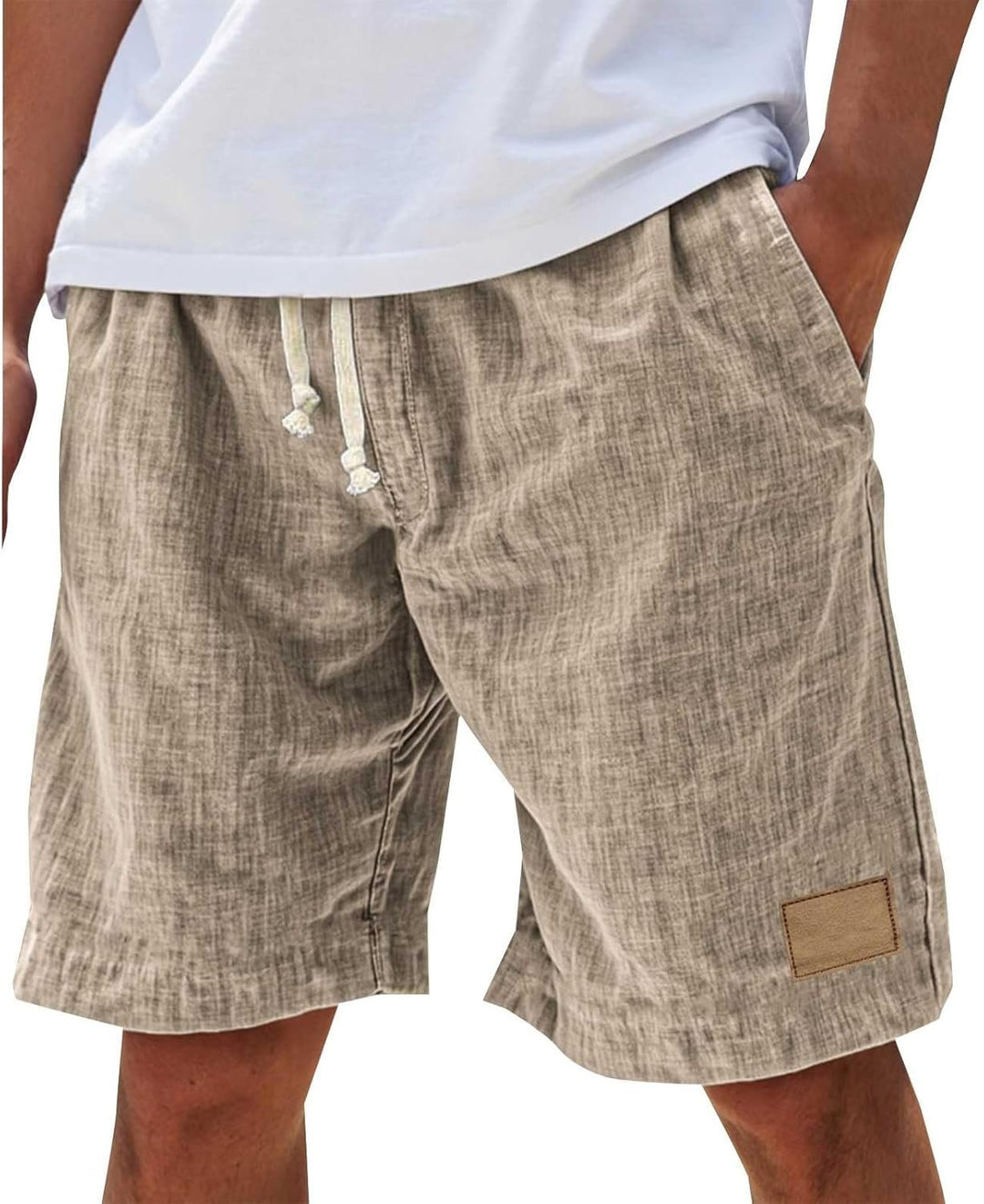 Model wearing men's comfortable relaxed fit summer shorts with drawstring for beach & casual style.