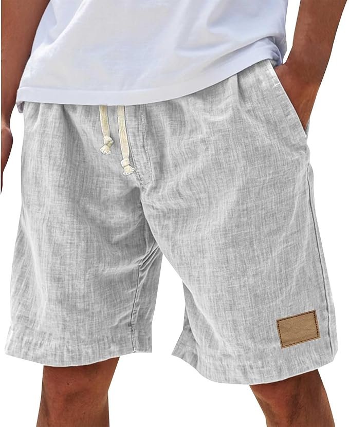 Men's relaxed fit summer shorts worn on a beach, perfect casual apparel for warm weather vacation.