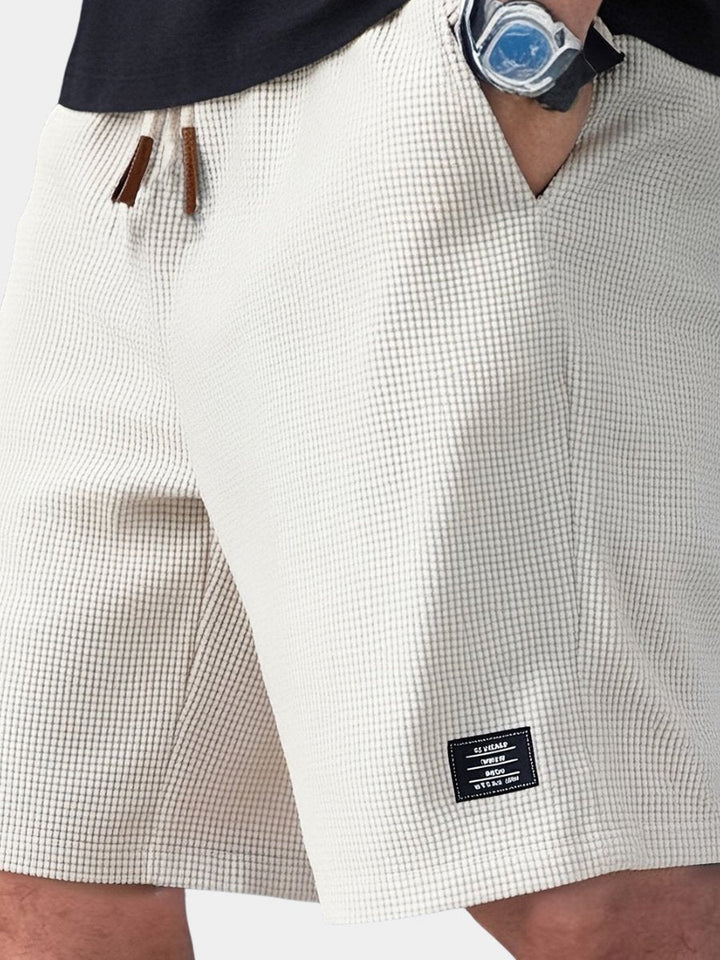 Men's relaxed fit waffle knit shorts for all-day comfort. Ideal for casual wear & lounging.