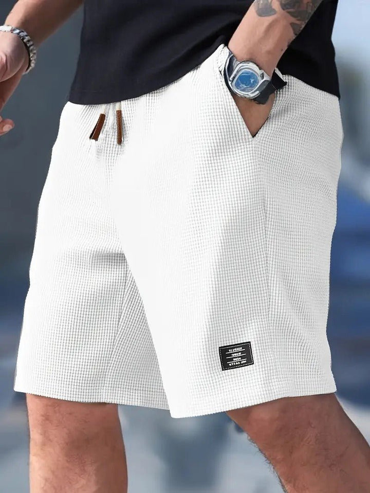 Back view of men's relaxed fit waffle knit shorts, showing comfortable design and casual appeal.