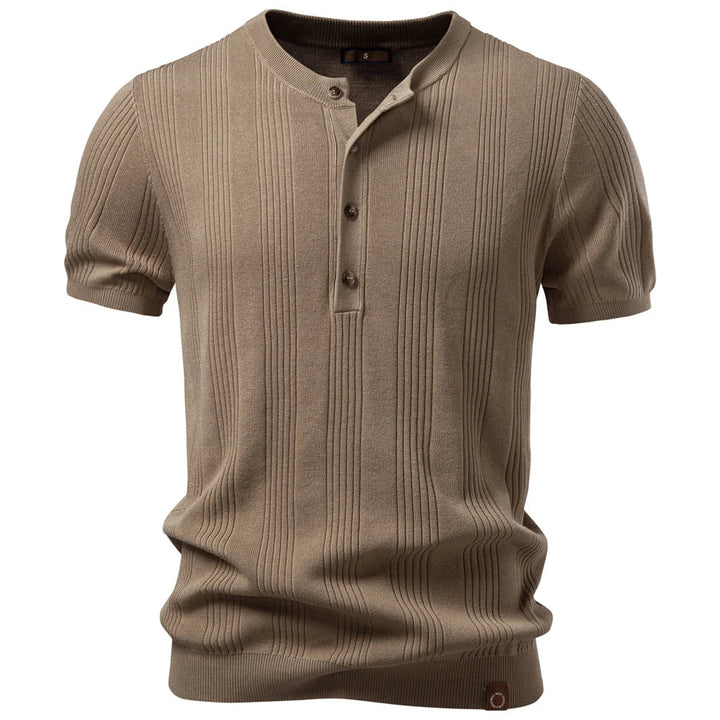 Classic men's short sleeve henley shirt with button placket. Ribbed texture offers a stylish casual look.