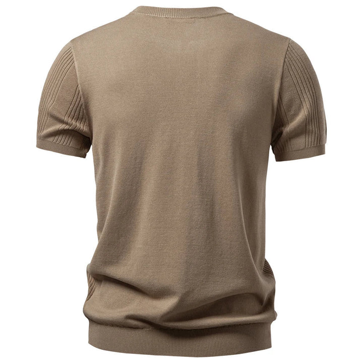 Stylish men's fashion henley shirt. Ribbed for texture and a modern casual aesthetic. Short sleeve comfort.
