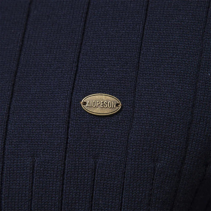Man wearing a versatile ribbed mock neck half zip sweater, perfect for layering, mensfashion & casual outfits.