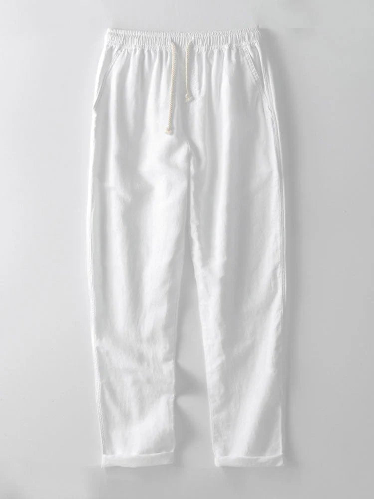 Men's short-sleeve shirt with rolled cuffs & matching casual pants, ideal for summer outfits.