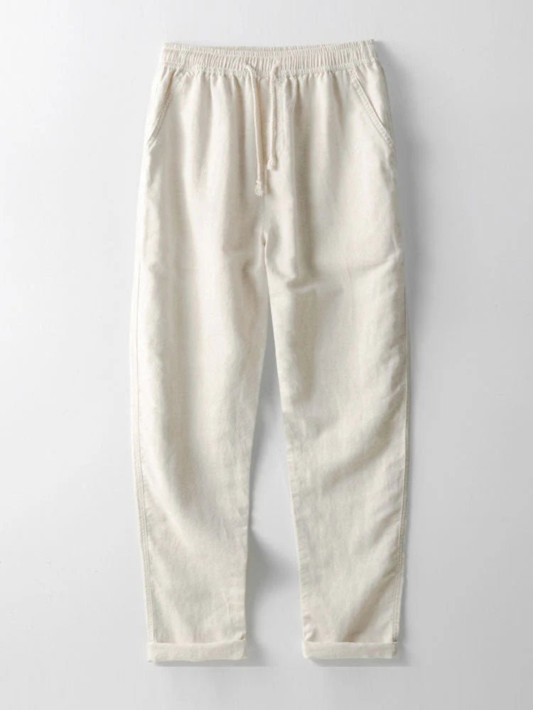 Effortless men's summer style: a two-piece set with a rolled cuff shirt and relaxed fit pants.