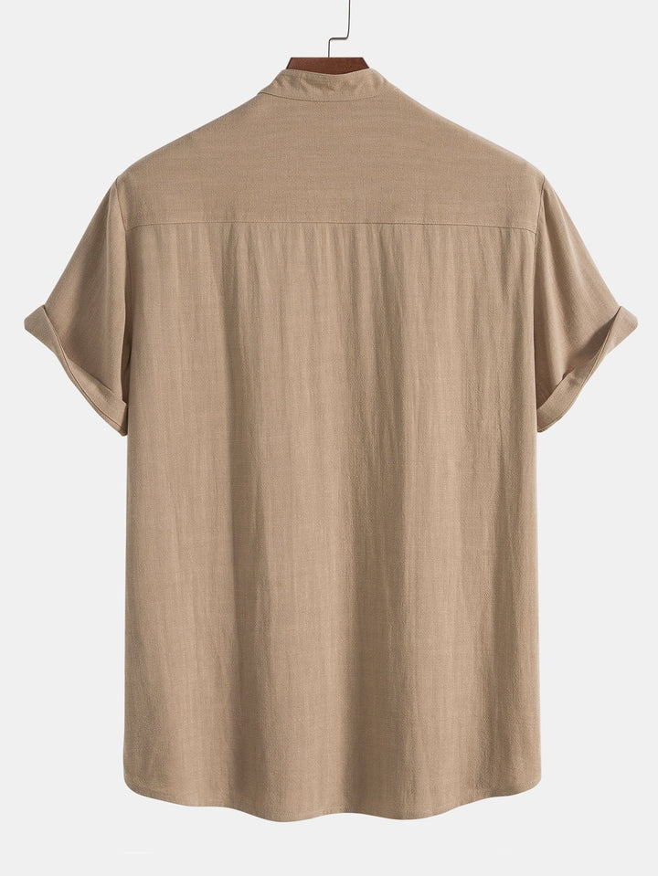 Men's casual summer outfit set: rolled cuffs shirt & comfy pants for beach or resort wear.