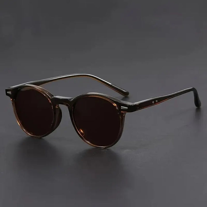 Classic men's round tortoiseshell sunglasses, lightweight & durable, offering a sophisticated fashion accessory.