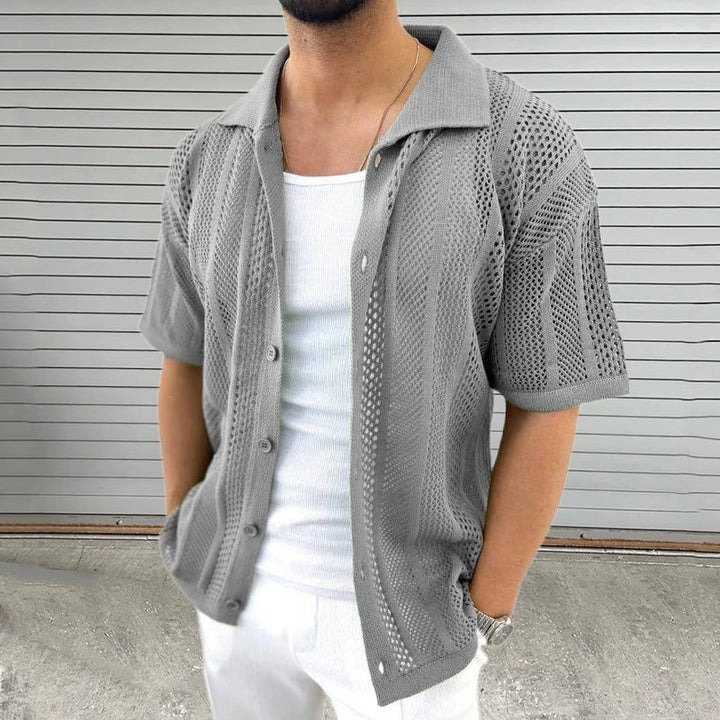 Comfortable black men's knit shirt, short sleeve with classic collar. A versatile top for casual summer fashion.