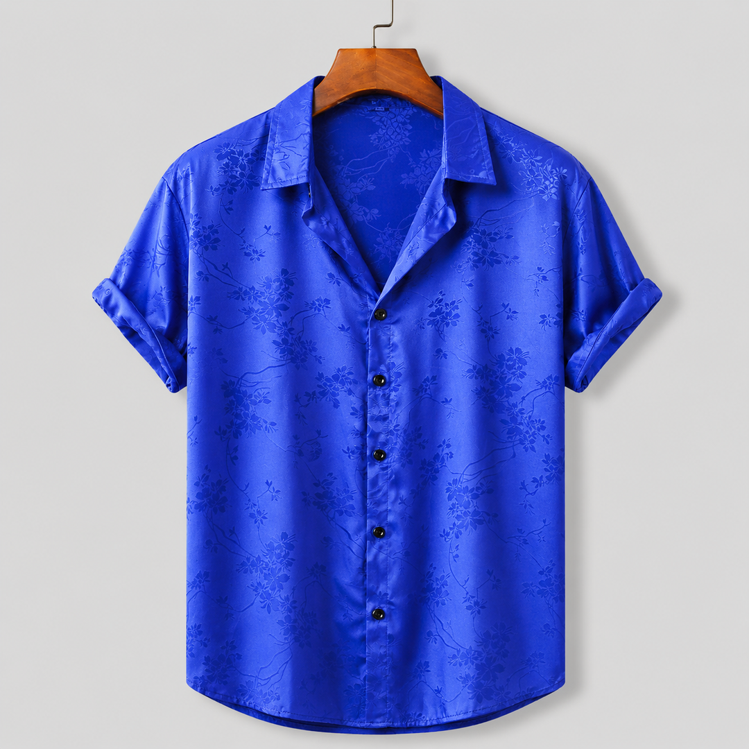 Stylish men's floral satin print polo, ideal for vacation wear & casual summer outfits. Regular fit.