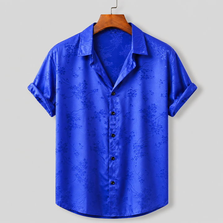 Stylish men's floral satin print polo, ideal for vacation wear & casual summer outfits. Regular fit.