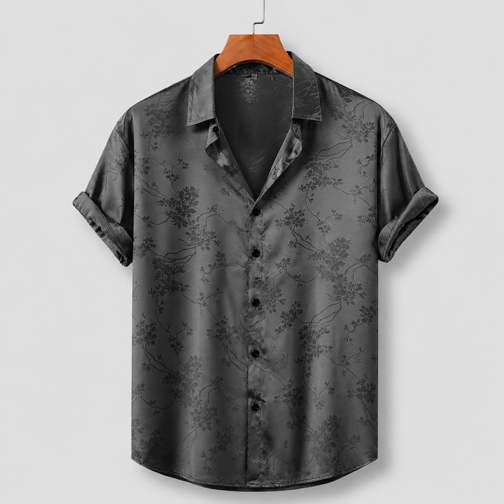Men's regular fit polo shirt with unique floral satin print. Short sleeve, perfect as a stylish casual top.