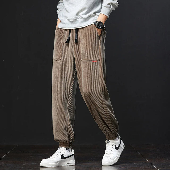 Active man in stylish men's signature joggers, perfect for movement, casual comfort, and everyday fashion.