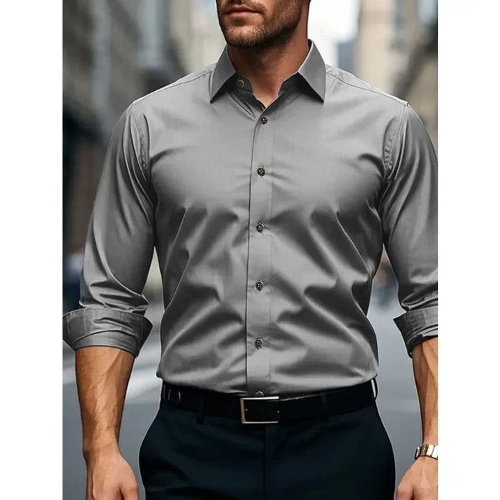 Stylish men's slim fit button-down long sleeve shirt. Ideal for business, formal, or smart casual wear.