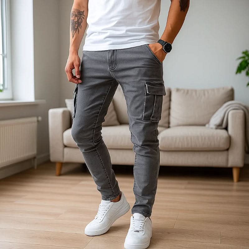 Stylish men's slim fit cargo jeans in dark wash denim, offering a modern streetwear look.