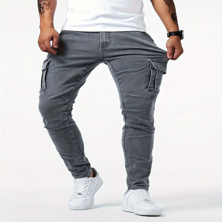 Versatile men's slim fit cargo pants in a dark wash, combining streetwear style with essential pockets.