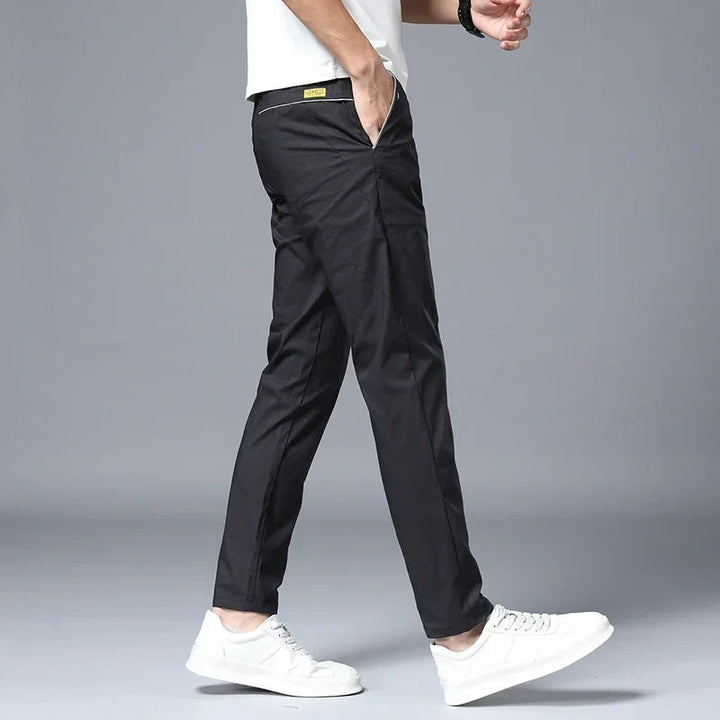 Modern men's comfort pants in a slim fit, designed for all-day wear & easy care.