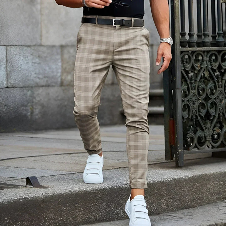 Men's checked tapered leg pants, slim fit and cropped ankle, embodying modern men's fashion trends.