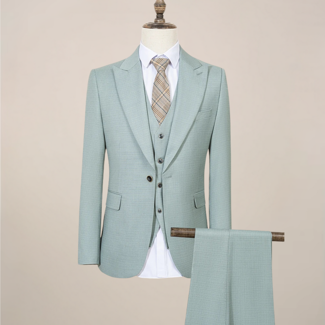 Men's slim fit emerald green three-piece suit. Perfect for summer weddings, business, or formal events.