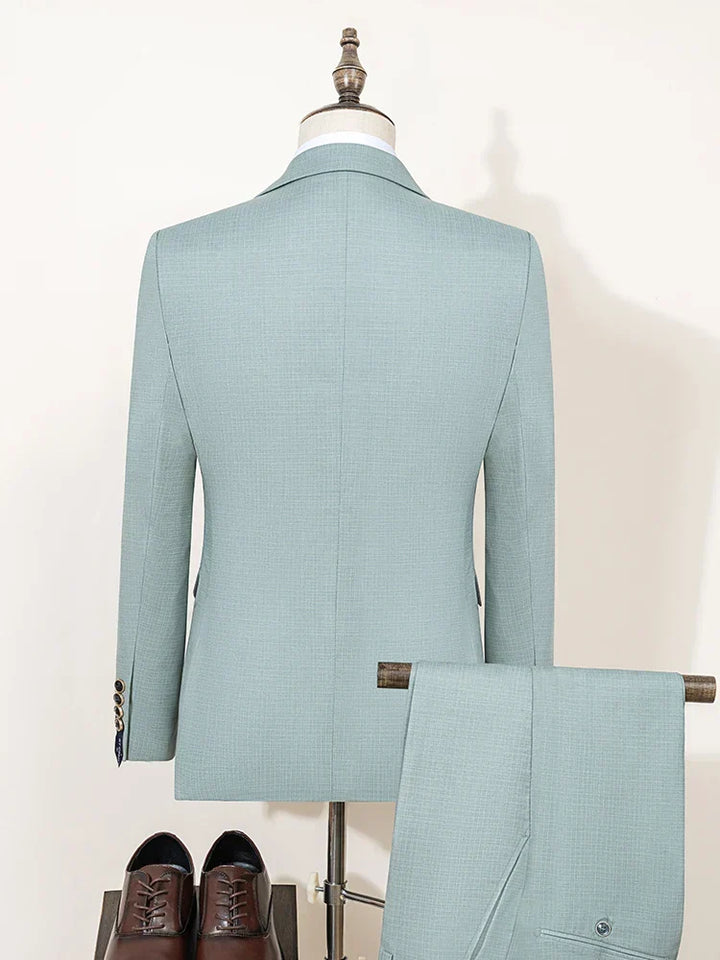 Stylish men's three-piece slim fit green suit, ideal for summer proms, garden parties & special occasions.