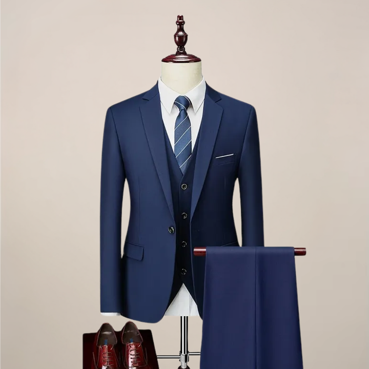 Men's slim fit navy three-piece suit for formal events. Includes jacket, vest, & trousers for an elegant, tailored look.