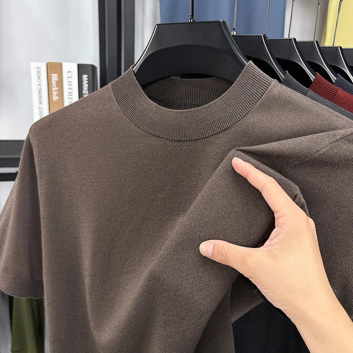 Man in slim fit short sleeve mock neck t-shirt outdoors, perfect for spring/summer.