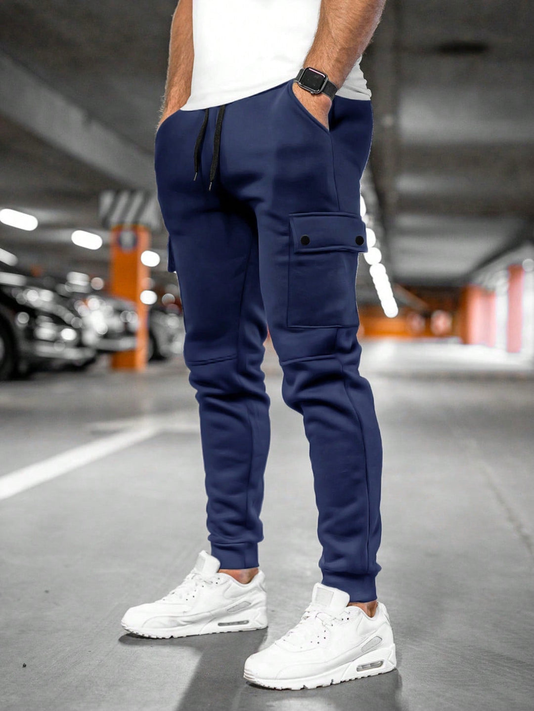 Modern men's tapered fit streetwear pants, black, cargo pocket, ideal for urban style.
