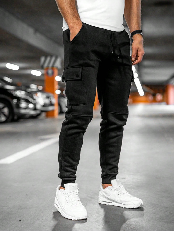Stylish men's slim-fit cargo joggers, black, suitable for casual fashion and urban settings.