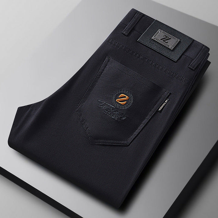 Black men's slim-fit stretch trousers. Comfortable cotton blend pants for versatile casual and smart casual styling.