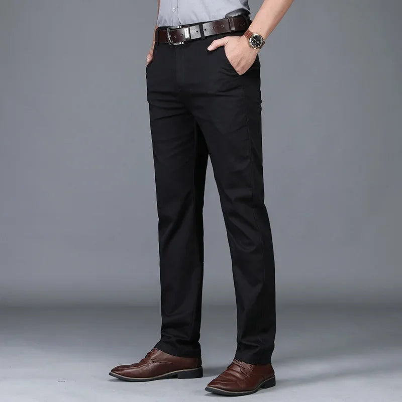 Burgundy men's slim-fit stretch pants. Stylish and comfortable cotton blend trousers for smart casual men's wear.