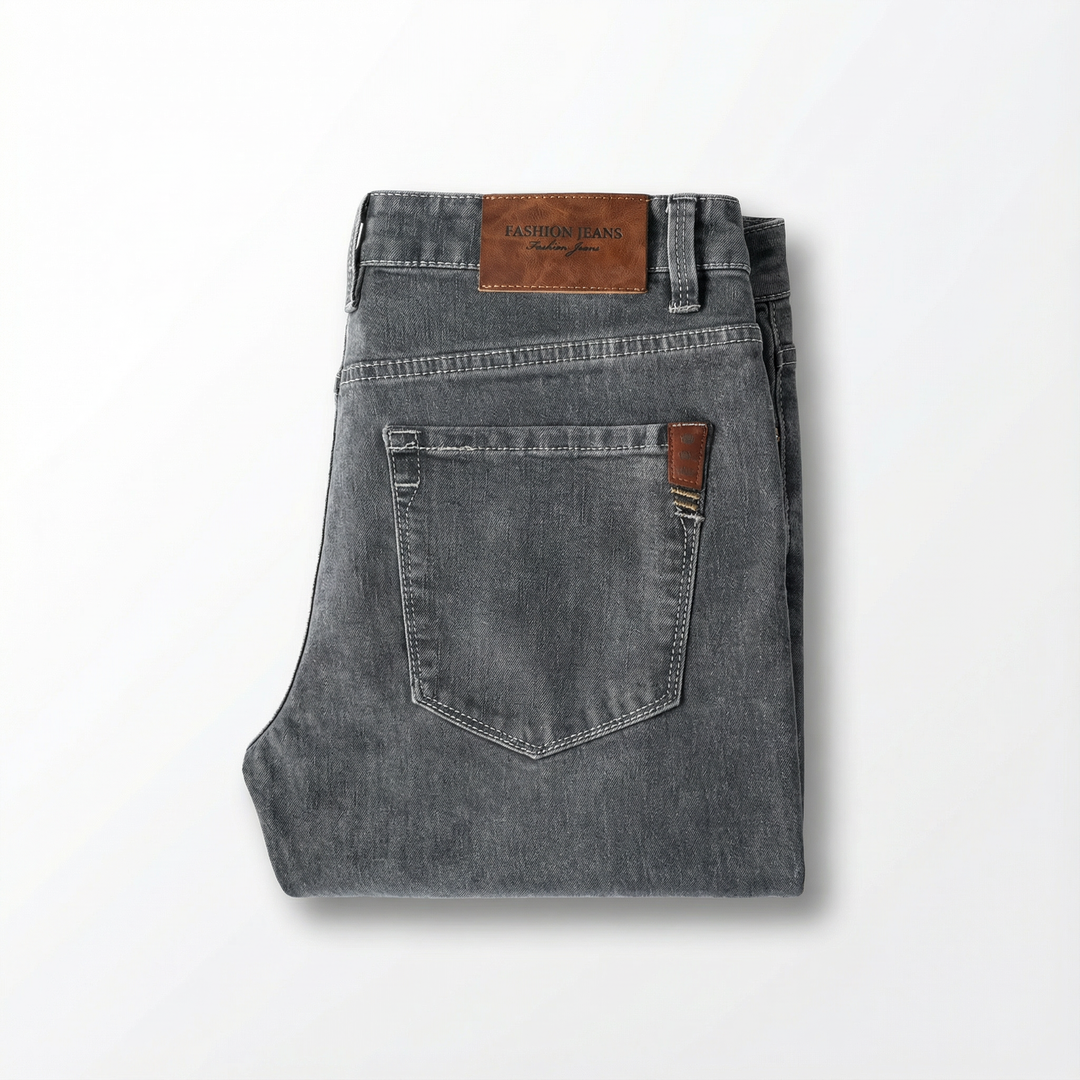 Flexible men's tapered jeans, slim fit, offering all-day comfort for casual wear with moisture-wicking.