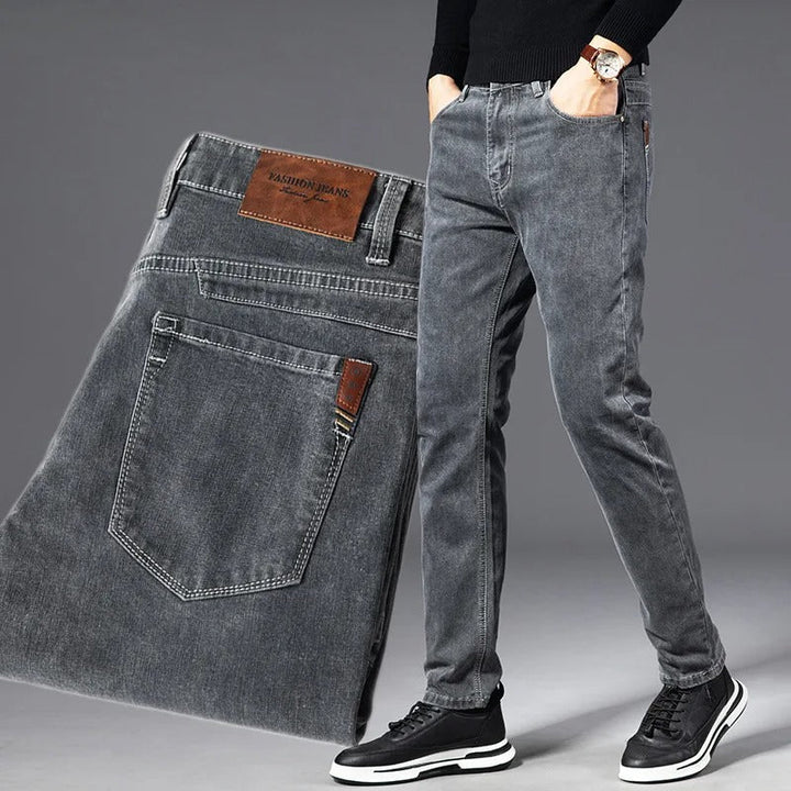 Comfortable slim fit men's jeans with odor control & moisture-wicking for flexible everyday casual style.