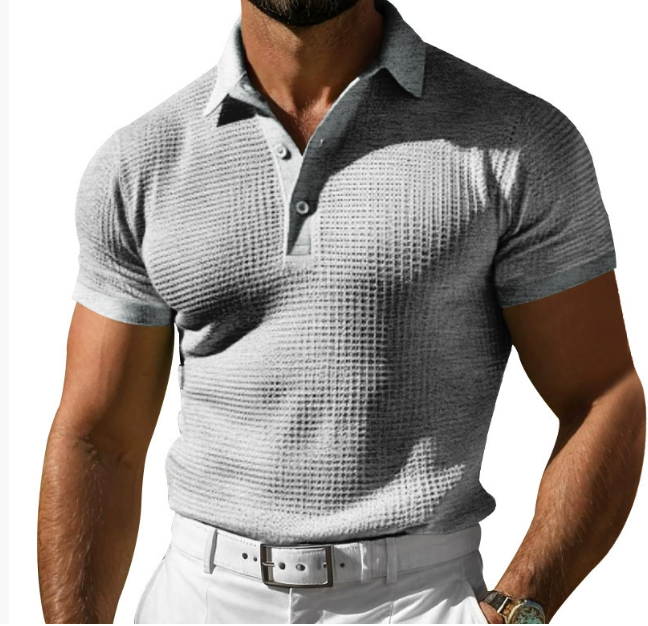 Stylish men's slim fit polo shirt, textured fabric, short sleeve. A versatile piece for smart casual men's fashion.