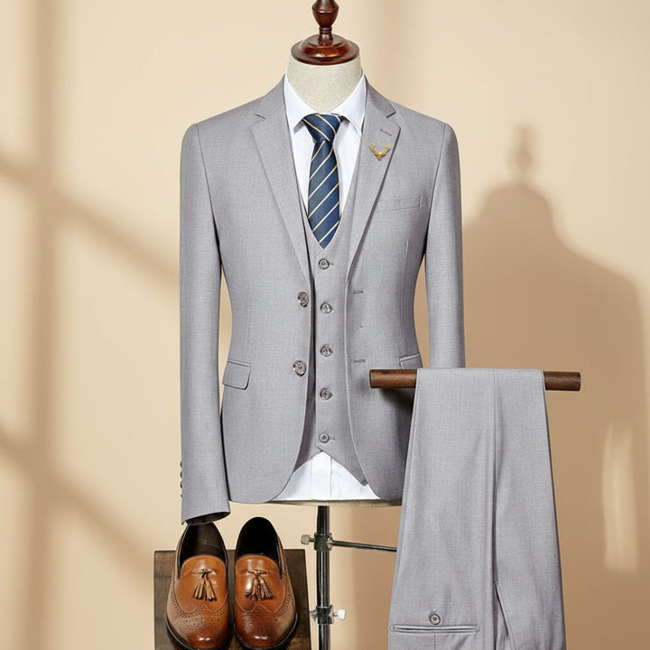 Men's slim fit three-piece suit, perfect for formal events, weddings, and business. Tailored elegant men's fashion.