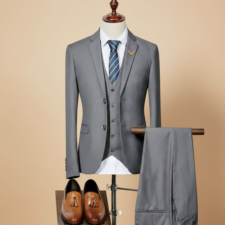 Elegant men's slim fit three-piece suit for weddings, formal wear, and special events. Modern tailored business attire.