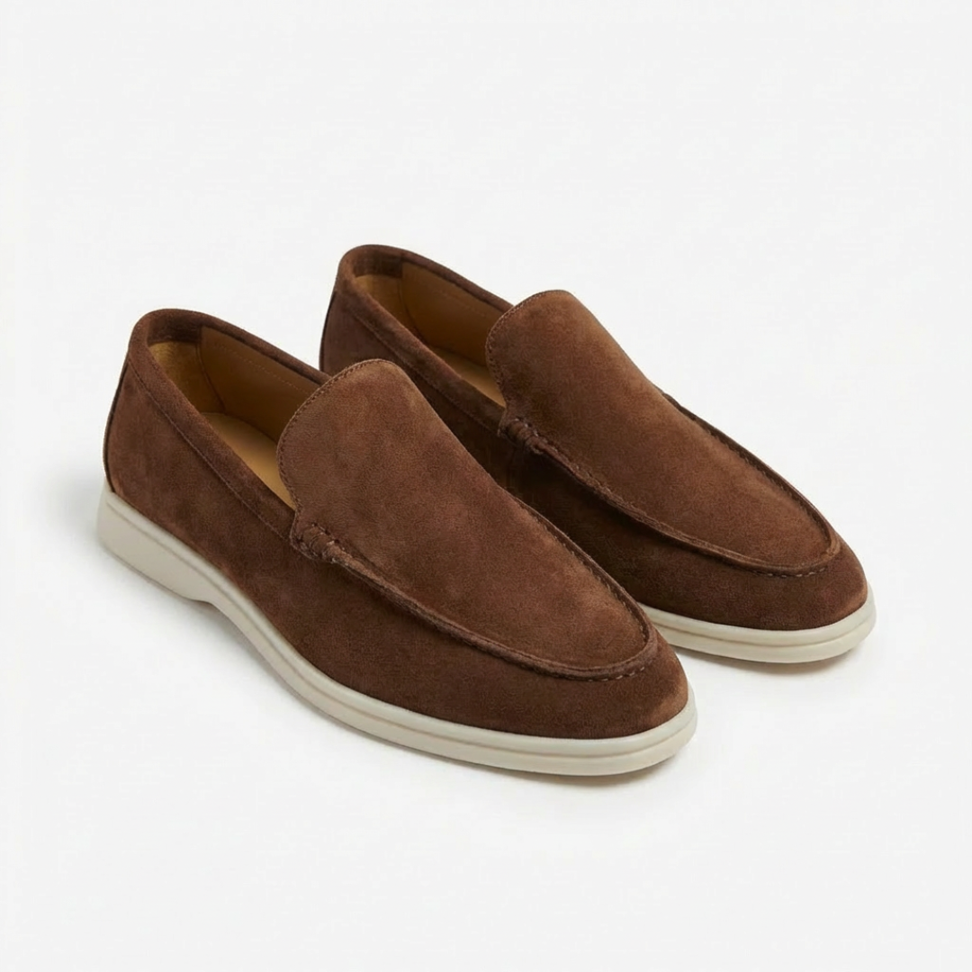 Comfortable men's slip-on driving loafers, featuring exposed stitching and a distinct contrast sole.