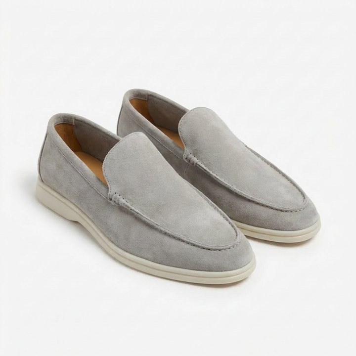 Men's casual slip-on loafers, detailed with modern exposed stitching and a sharp contrast sole.