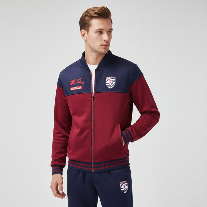 Detail of full zip jacket & elastic cuffs on a men's sporty baseball tracksuit set for activewear.