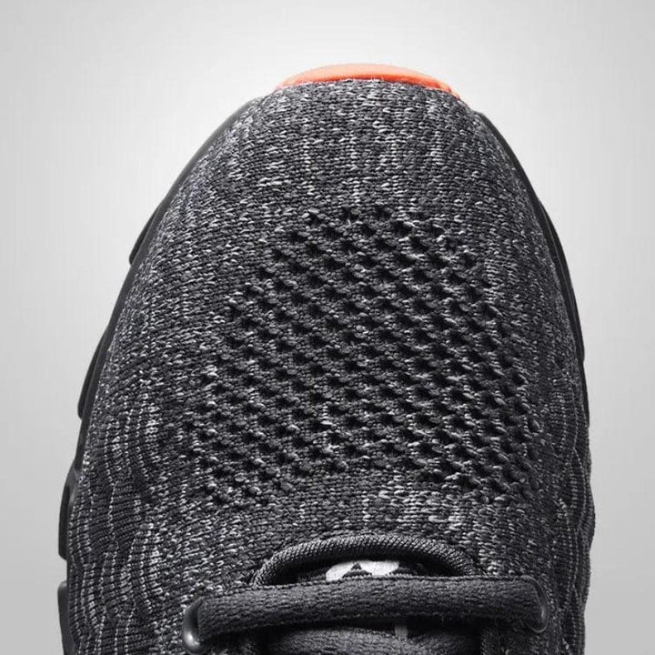 Close-up of StrideMax men's walking shoes, highlighting flexible material & supportive design for comfort.