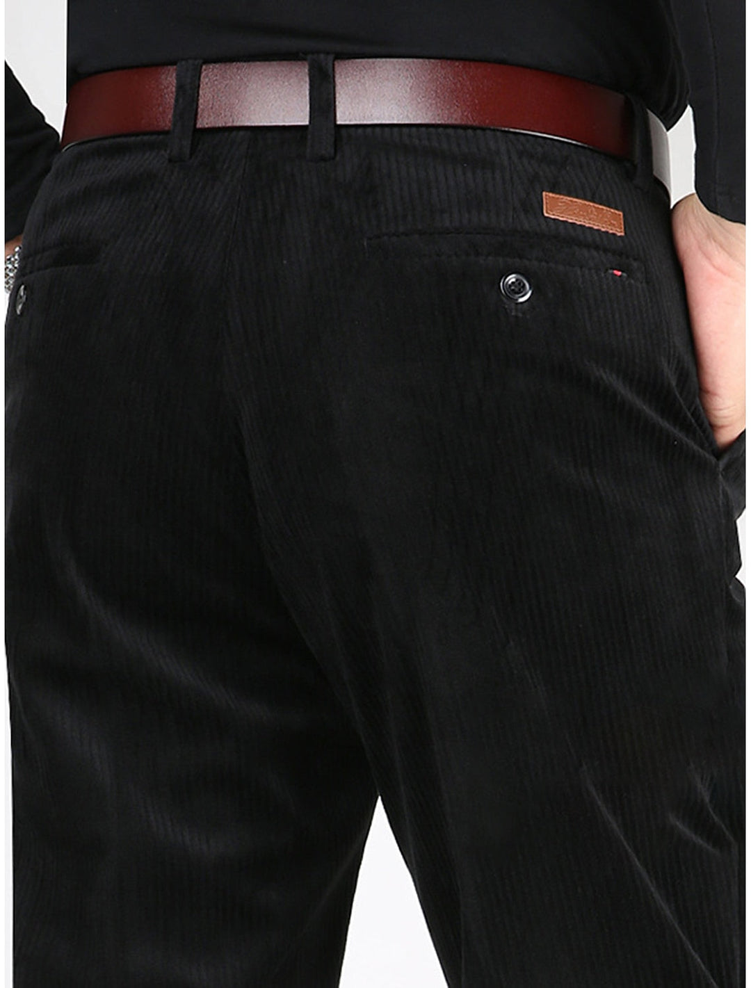 Close-up of modern men's structured ribbed pants, showcasing comfortable texture & relaxed straight fit.