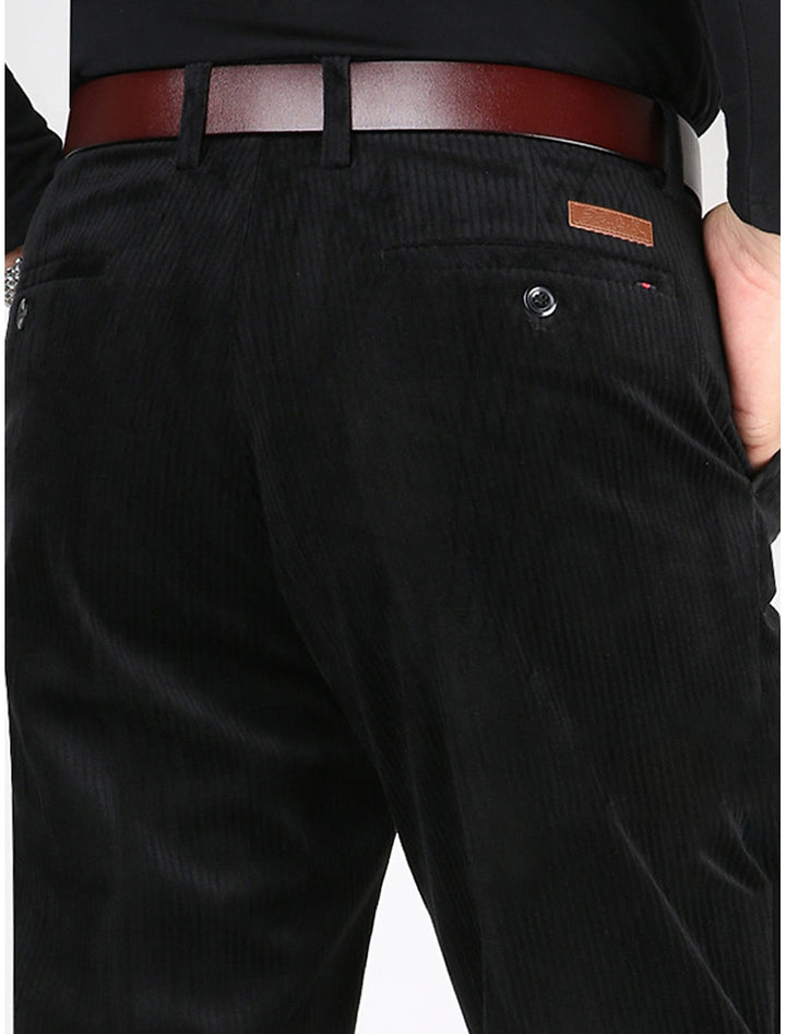 Close-up of modern men's structured ribbed pants, showcasing comfortable texture & relaxed straight fit.