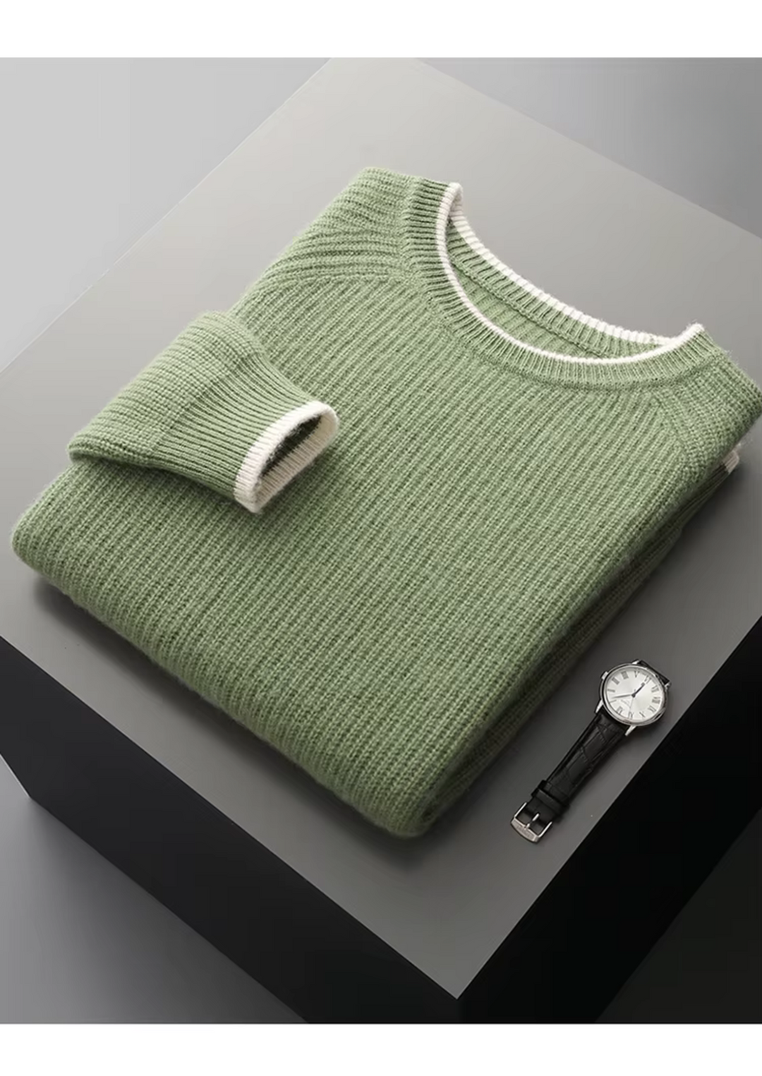 Man wearing a stylish crew neck sweater over a collared shirt for a smart casual look.