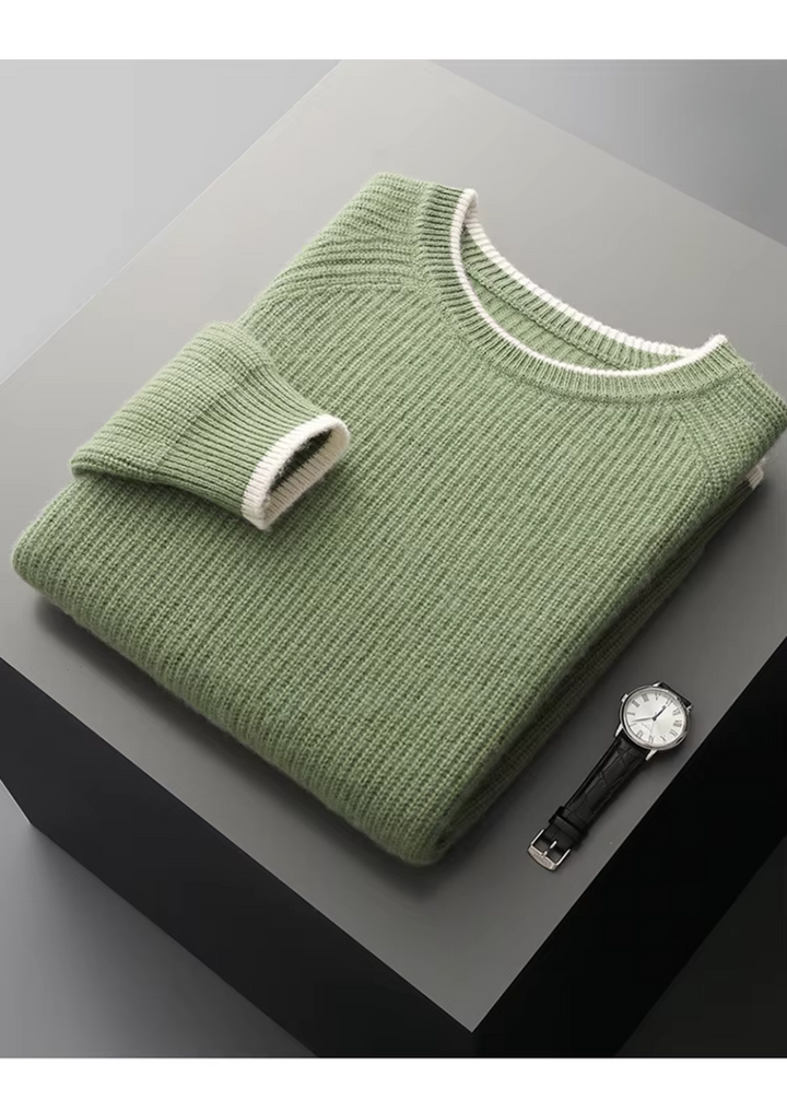 Man wearing a stylish crew neck sweater over a collared shirt for a smart casual look.