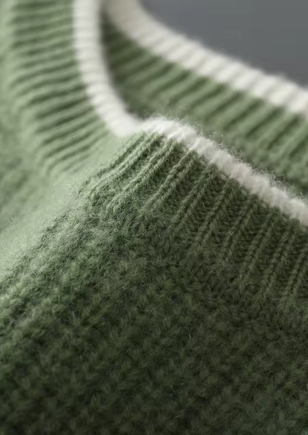 Full shot of man in a comfortable crew neck sweater, paired with jeans for a casual outfit.